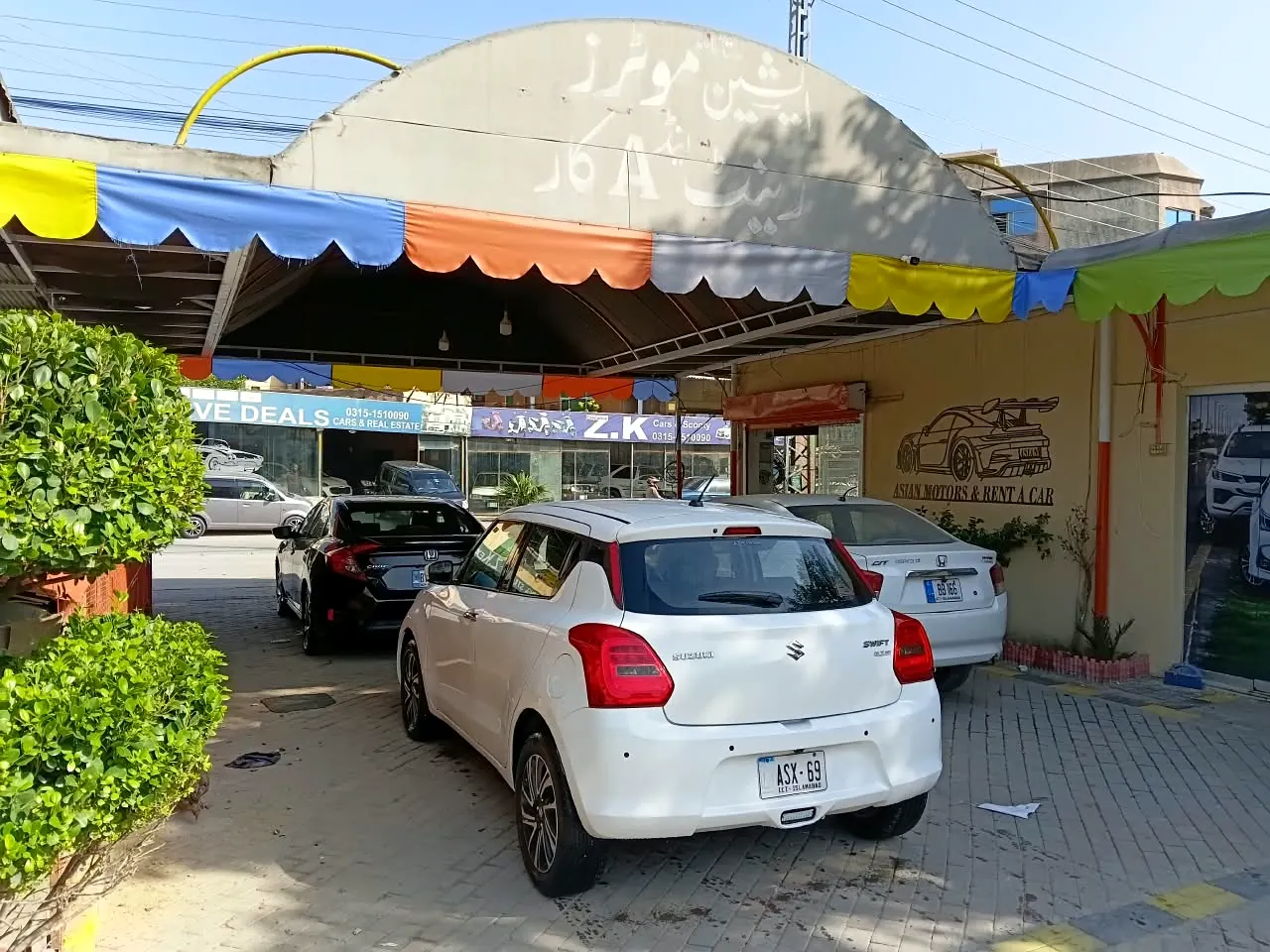White Suzuki Swift and Honda City